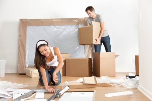 Removal team planning a Mayfair home move with packed boxes and furniture