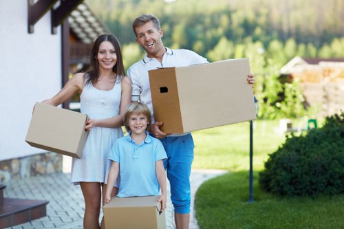 Local movers handling furniture near a Mayfair property