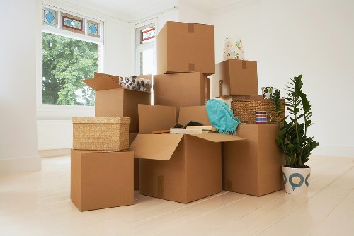 Packed household boxes and furniture prepared for a Mayfair relocation