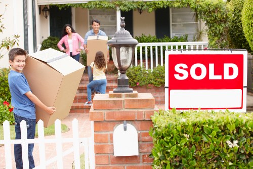 Commercial removals team handling office furniture and boxes in central London